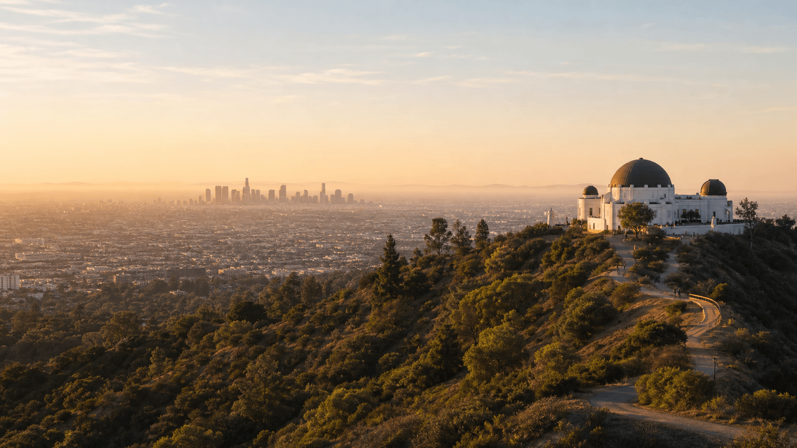 White domed observatory on a hill above a sprawling city