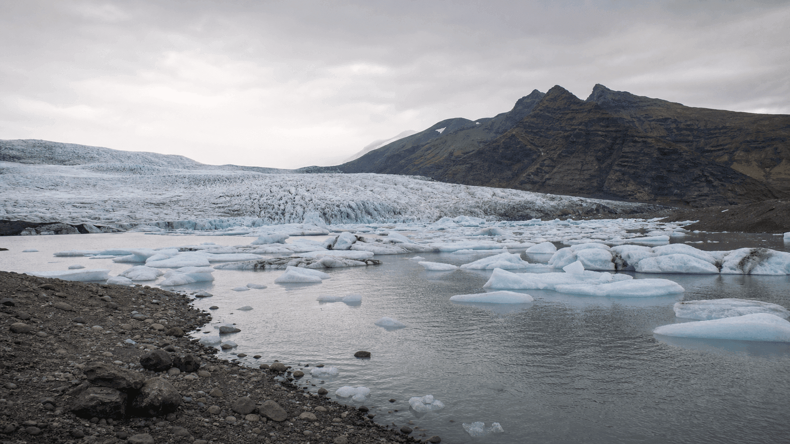Glacier front beyond a lagoon