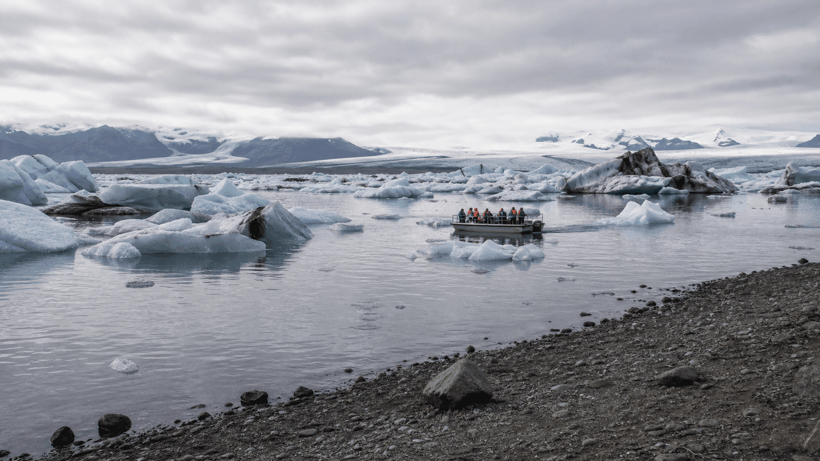 Group on a boat among icebergs