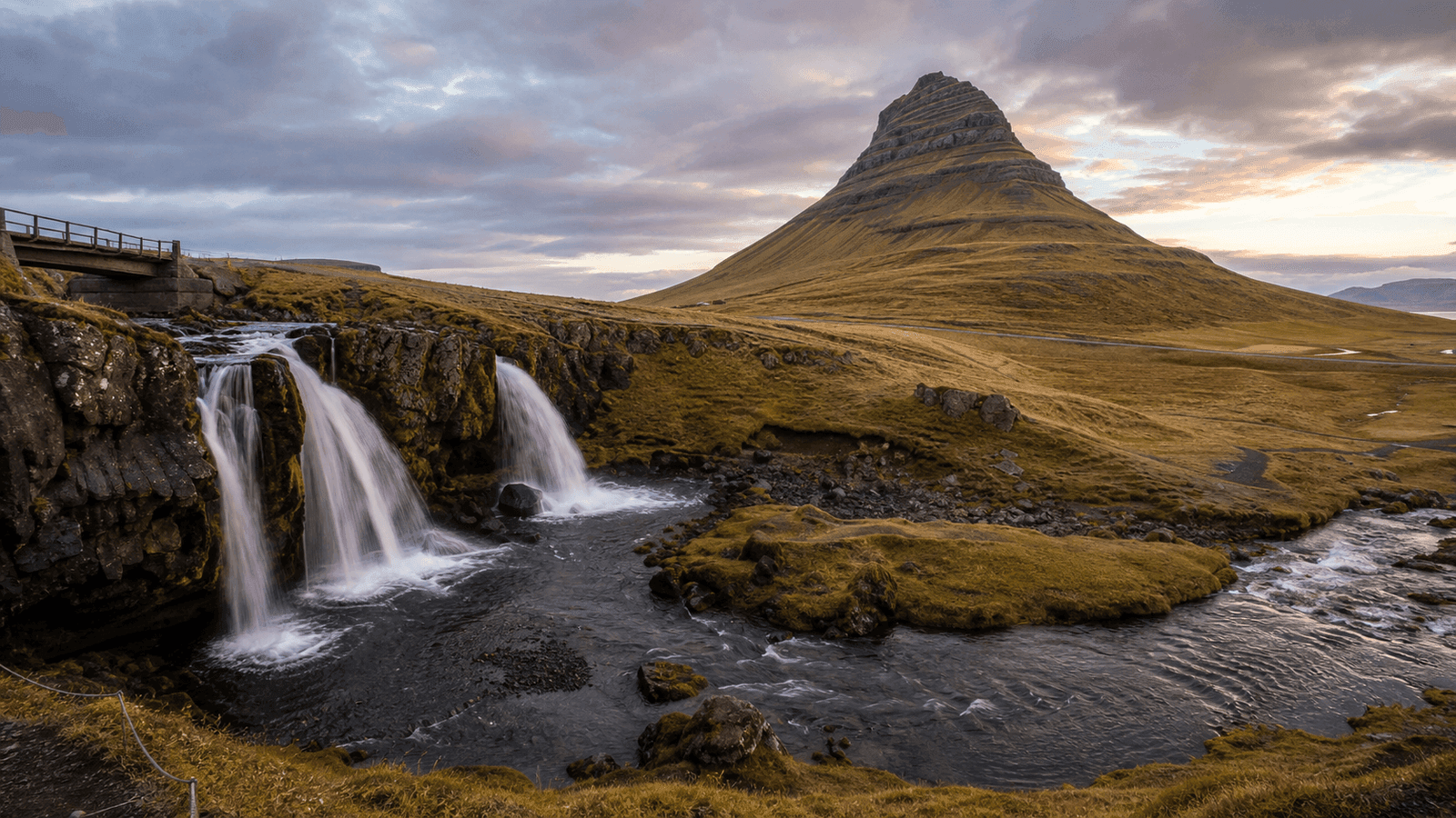 Waterfalls beneath a distinctive mountain