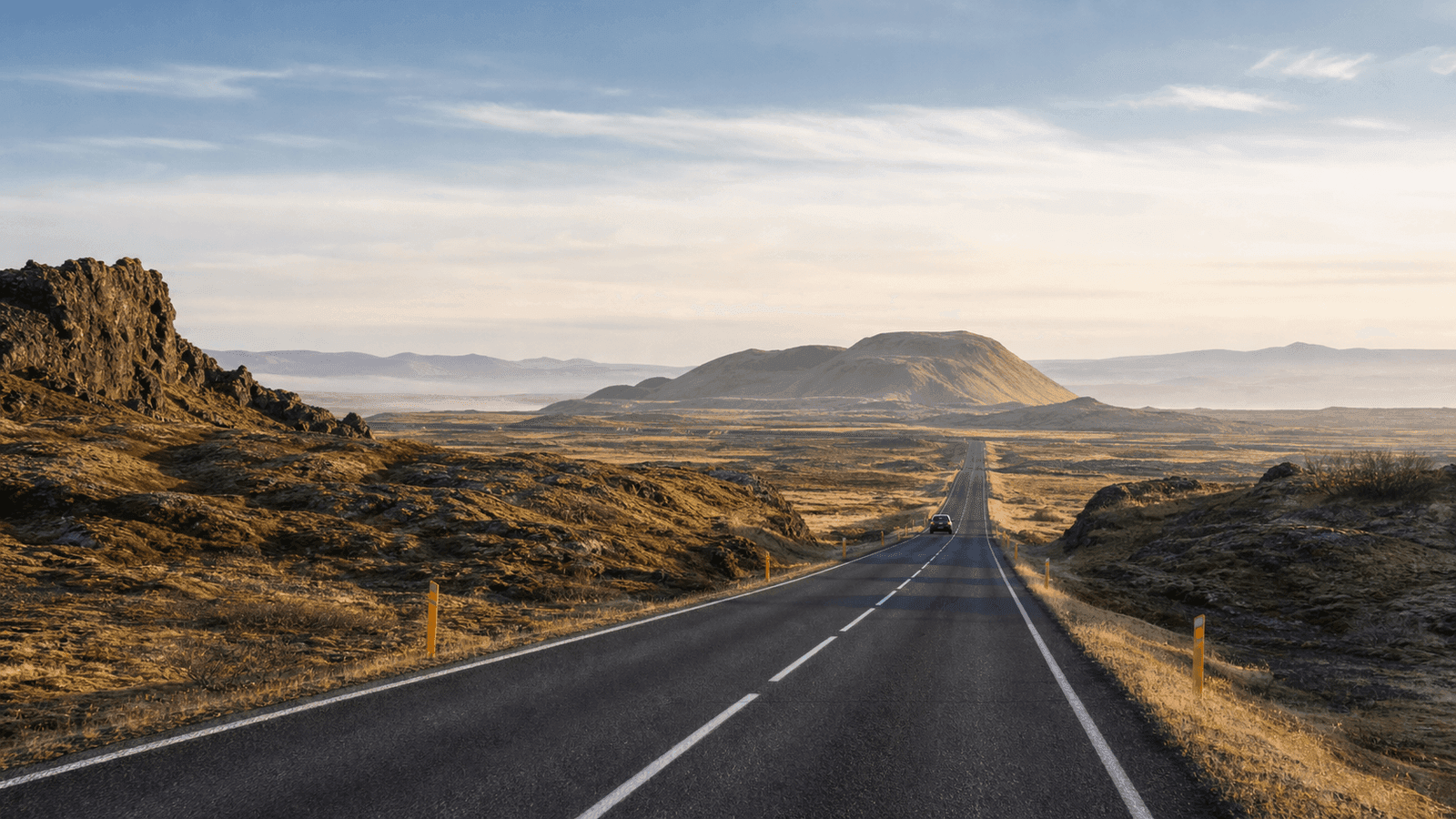 Road through lava and mountain terrain