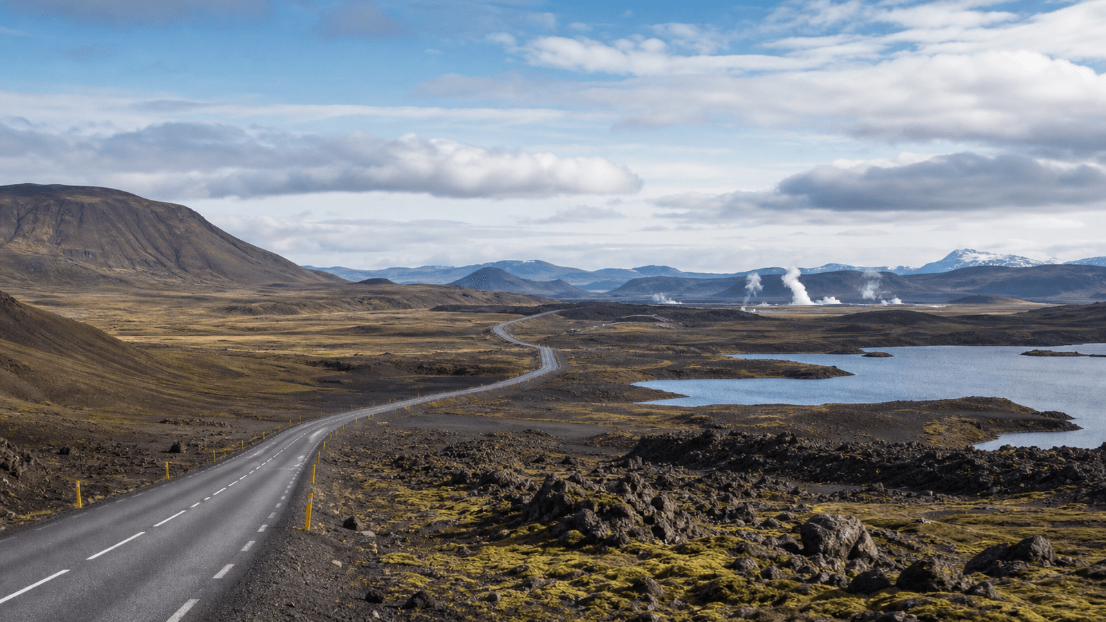 Road and steam in volcanic terrain