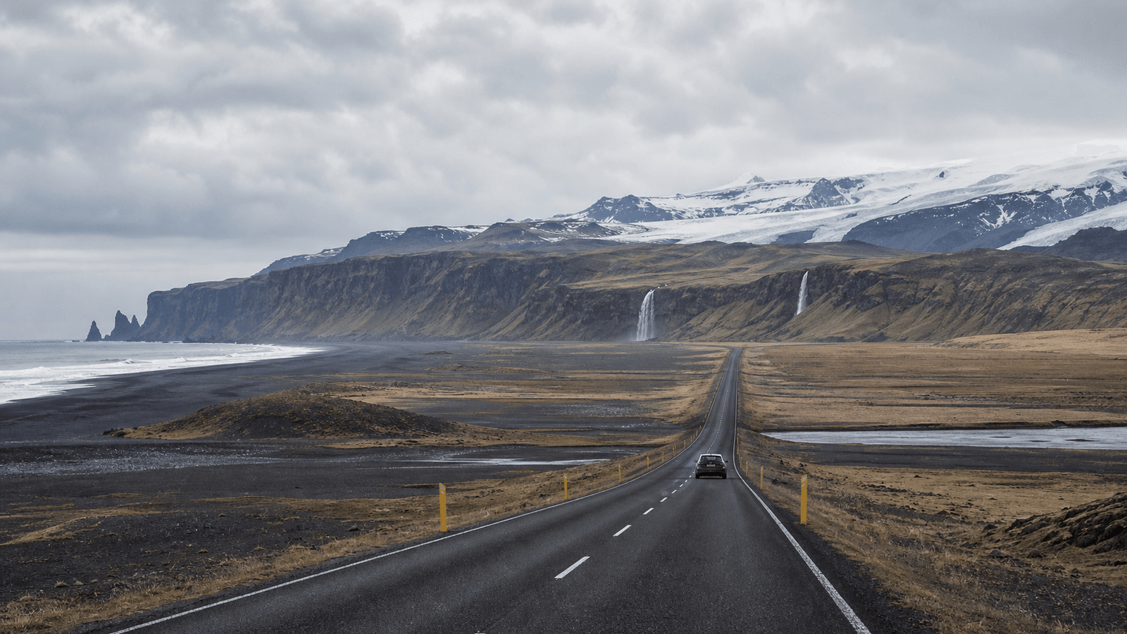 Road, waterfall and rocky coast in a composite scene