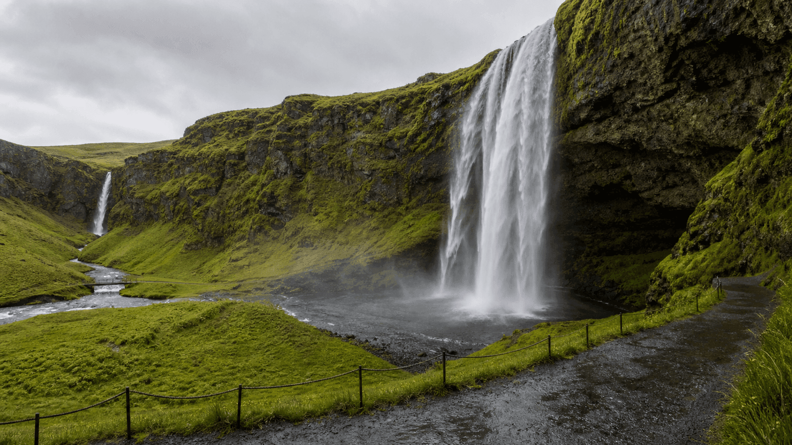 Waterfalls on green coastal cliffs in a composite scene