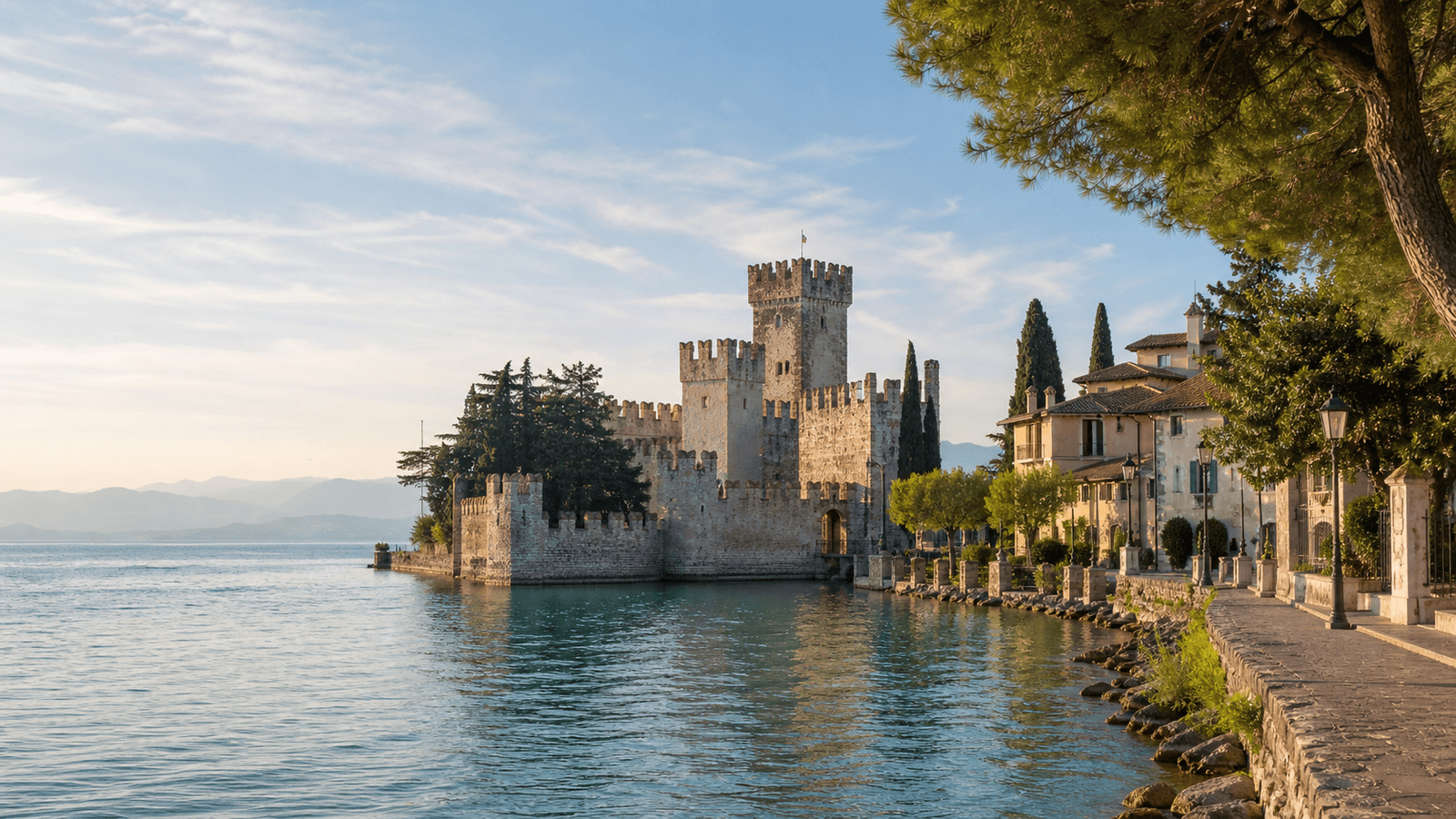 Battlemented castle beside the lake.