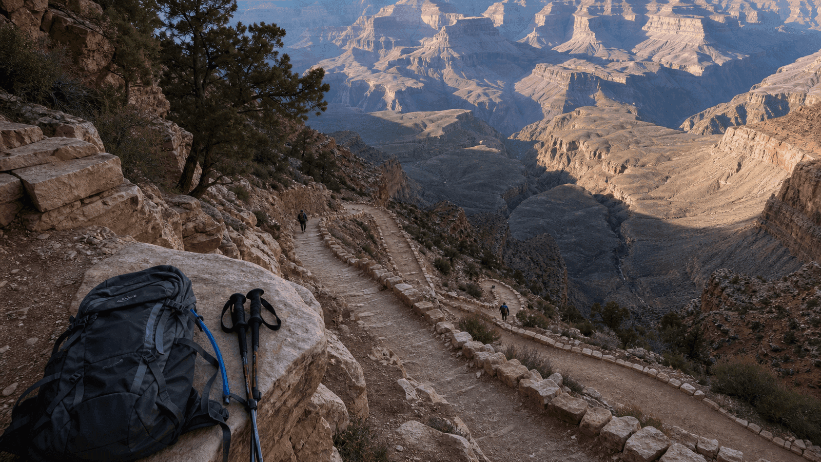 Narrow switchback trail with a backpack and walking poles