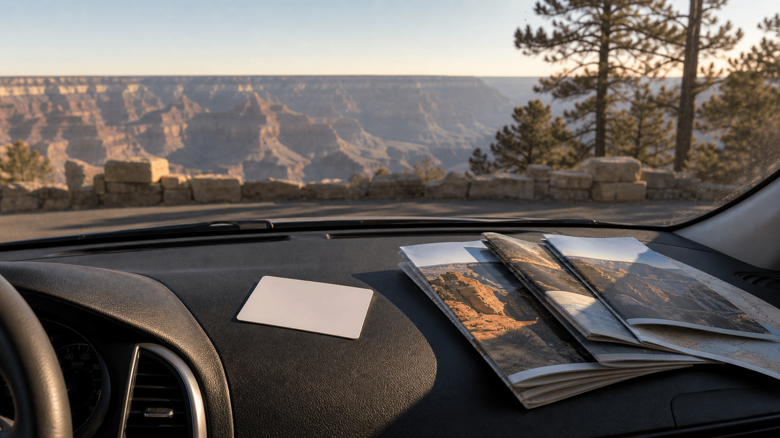 Unlabelled card and park brochure on a dashboard